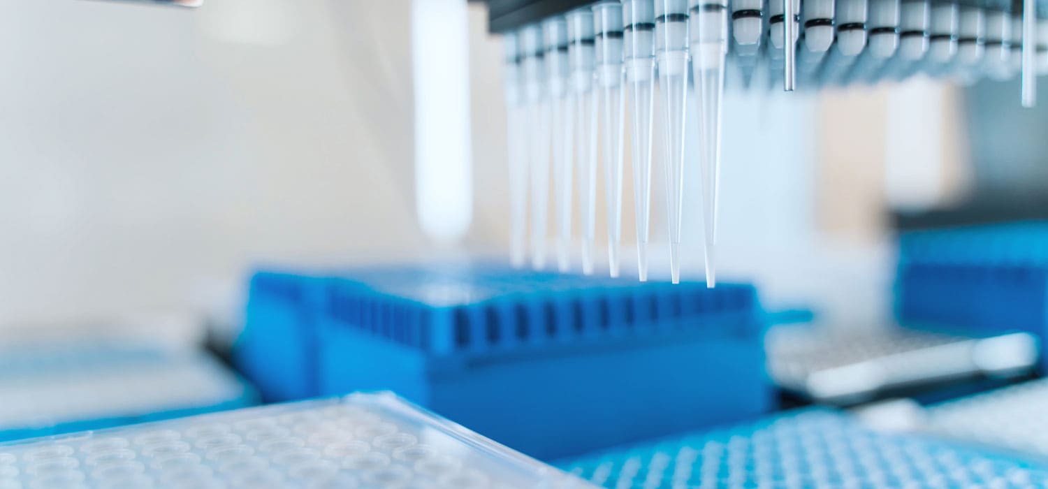 A stock image of a liquid handler during an automated ELISA workflow.